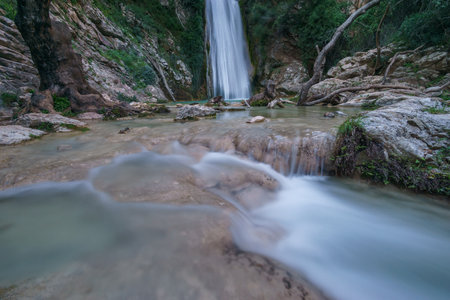 Beautiful natural waterfall of Neda with pool of torquoise water in the rural countryside, Phigalia, Peloponnese, Greeceの写真素材
