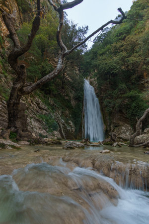 Beautiful natural waterfall of Neda with pool of torquoise water in the rural countryside, Phigalia, Peloponnese, Greeceの写真素材