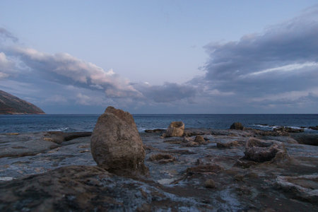 Petrified tree trunk at beautiful landscape of Geopark of Agios Nikolaos Petrified Forest at mediterranean sea coast, Laconia, Peloponnese, Greeceの写真素材