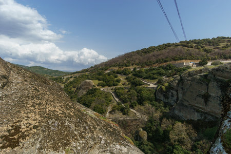 Scenery with hiking path at famous rock formations of Meteora to Holy Trinity Monastery building on top of the rocks, Kalambaka, Thessaly, Greeceの写真素材