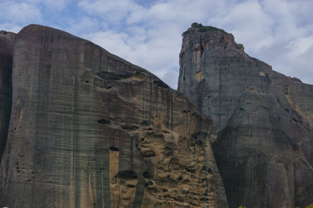 Detail view or eroded caves in side of sandstone rock formations of Meteora, Kalambaka, Thessaly, Greeceの写真素材