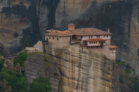 Detail view of landscape of the famous rock formations of Meteora with Roussanou Monastery on top of...