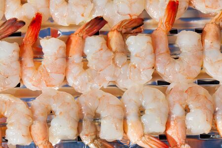 Grilled skewers with fresh shrimps.の写真素材