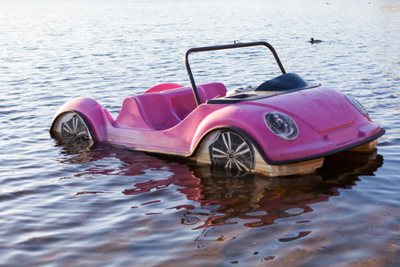 pink toy on the water at the lake, closeup of photoの写真素材