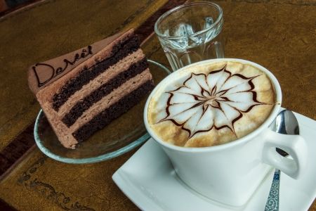 A cup of coffee Mocca served together with chocolate cake の写真素材