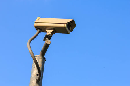 Single CCTV on Post with blue sky の写真素材