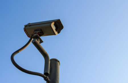 Single CCTV on Post with morning sunlight.