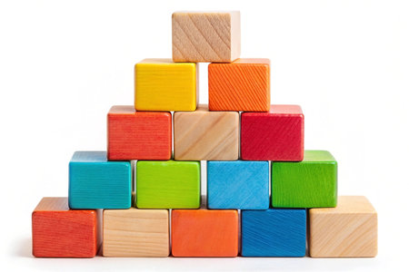Colorful wooden blocks pyramid, studio, white background, growth conceptの素材