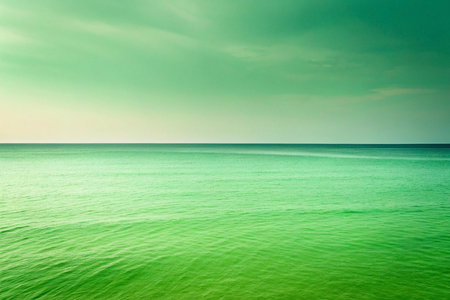 Calm green ocean, coastal sunset, cloudy sky, tranquil scene, travelの素材