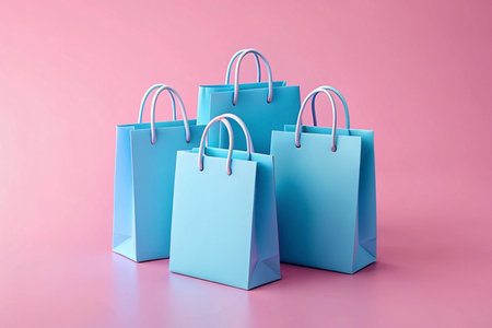 Blue shopping bags pink background online retail advertisingの素材