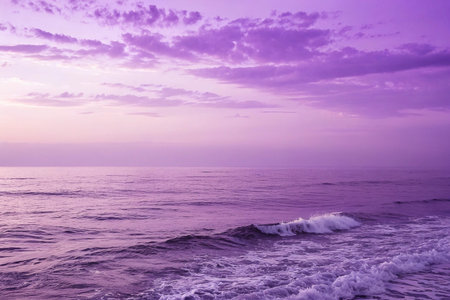 Purple sunset ocean waves beach calm sea background serenityの素材