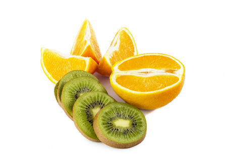 ripe kiwi and orange isolated on white backgroundの写真素材