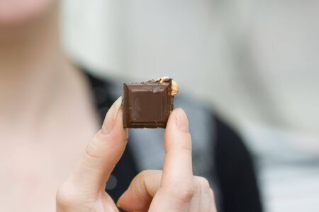 chocolate pieces in woman's handsの写真素材