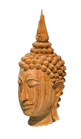 buddha head wooden sculpture isolated on whiteの写真素材