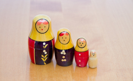 russian dolls on wooden table の写真素材