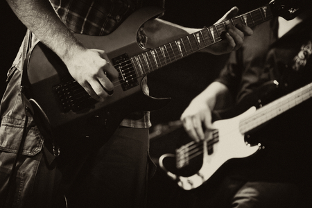 guitarists of a rock band with a guitar の写真素材