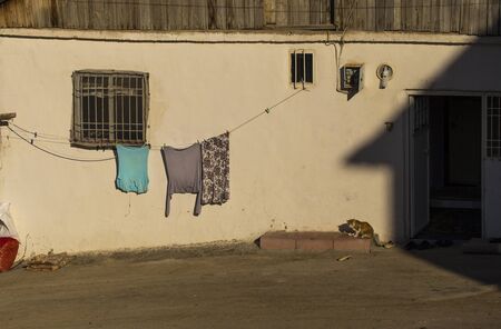 Laundry hanging on a wall of a house in Malatya suburbsの写真素材