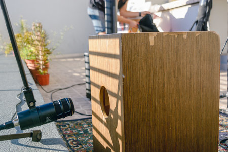 Flamenco acoustic box with condenser microphone in the sound outlet opening, percussion set for live acoustic music. music concept, copy space.の写真素材