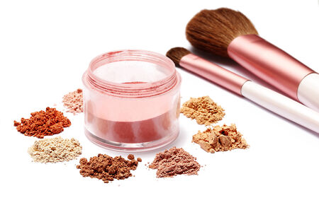 make up powder sweet color and brush on white background 