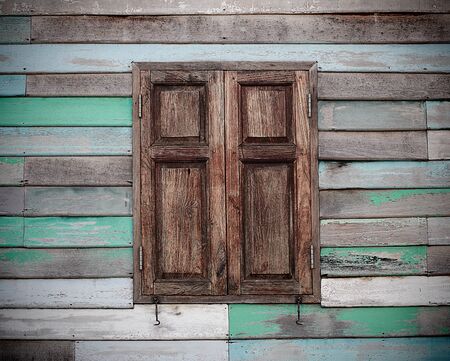 the wood wall and window old condition many colorの写真素材