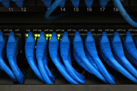 Network cable plug and switch,Data Center in Server room concept.