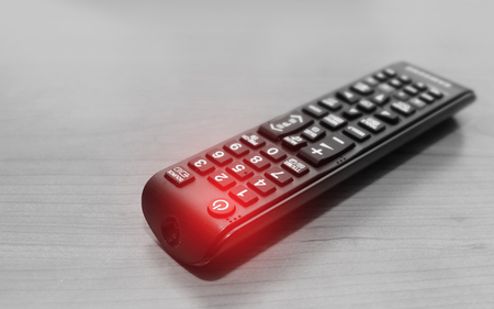 Close up Power button Red light on Remote control TVの写真素材