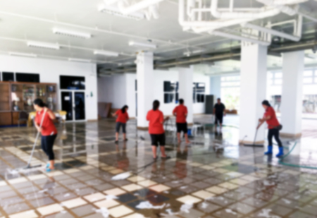 Women worker or janitor washing floor in ground of building blur for backgroundの写真素材