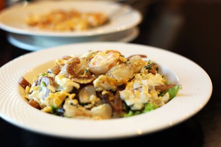 Fried Rice Noodles with Chicken and seafood.- Dry noodle with vegetable and squid street food Thai style.の写真素材