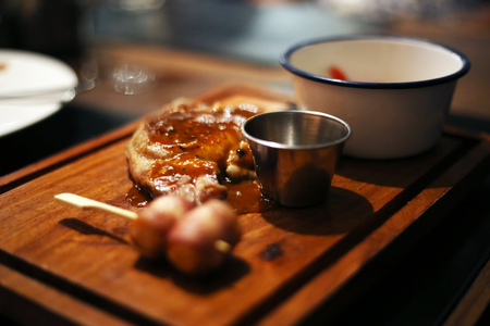 Pork chops steak with sausage wrapped bacon side dishes.の写真素材