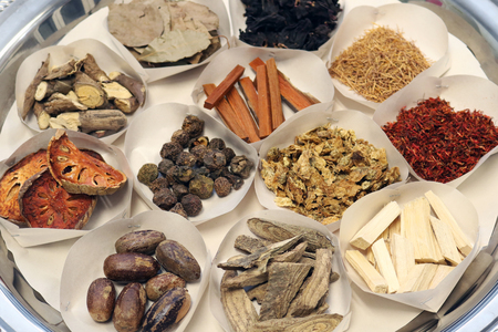 Dried Herbs in paper tray for sacrificial offering or alternative medicine asian thai traditional therapy.の写真素材