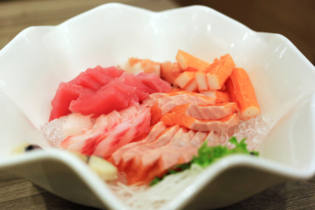 Sashimi bowl set such as salmon, mackerel, crab stick (Kanikama) and tuna delicious fresh raw fish japanese food.の写真素材