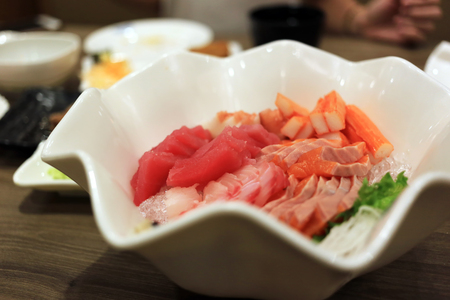 Sashimi bowl set such as salmon, mackerel, crab stick (Kanikama) and tuna delicious fresh raw fish japanese food.の写真素材