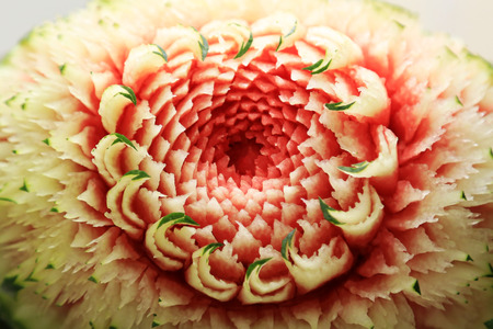 Thai pattern from watermelon carving background. Fruits carving Thai traditional art decoration display.の写真素材