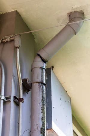 Water leaking from pipe line broken in building. Water drop from drain pipe damage house problem...