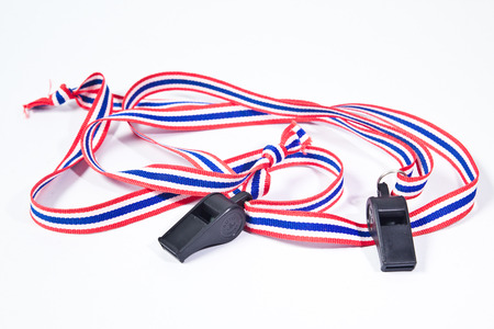 black whistles with Thailand national flag lanyard on white backgroundの写真素材