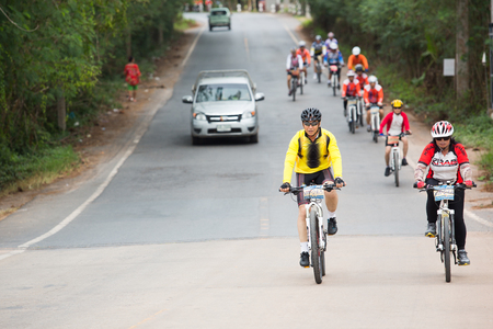 SURATTHANI, THAILAND - JULY 10: Unidentified riders in action during "Suratthani Bike Race 2013" on July 10, 2013 in Suratthani, Thailand. It is a free, open, and un-ticketed event.のeditorial素材