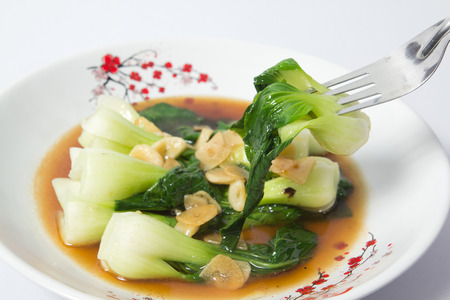 fried chinese cabbage in oyster sauce one on forkの写真素材