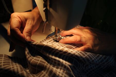 Sewing process with sewing machine (Selective focus)の写真素材