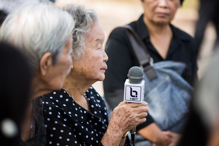 SURATTHANI, THAILAND - OCTOBER 16 : Crowds of mourners during Mourning Ceremony of King Bhimibol pass away at Suratthani City Hall on October 16, 2016 in Suratthani, Thailand.のeditorial素材