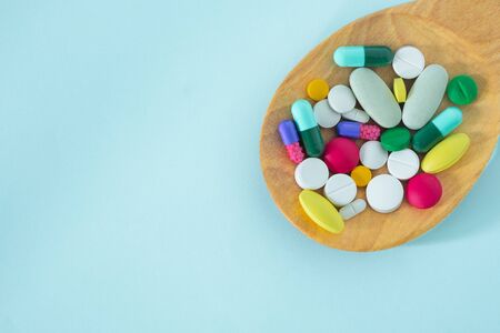Flat Lay, Top View of Colorful, Assorted pharmaceutical medicine pills. Many pills and tablets in...