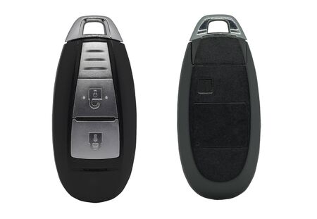 Car key remote, plastic black with two keys lock and unlock alarm system for the car isolated on white background.の写真素材