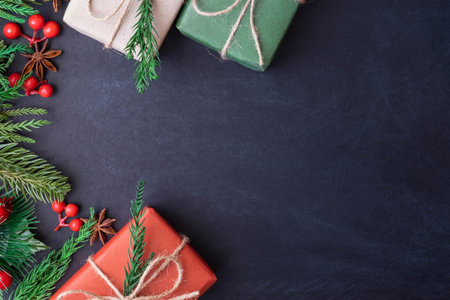 Top view above of Christmas holiday background. Composition with fir pine branches, Gift kraft box...