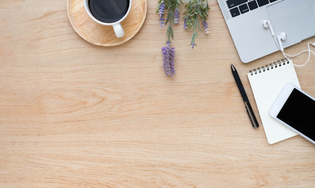 Top view above of Wooden office desk table with keyboard of laptop and notebook with equipment other office supplies. Business and finance concept. Workplace, Flat lay with blank copy space.の写真素材