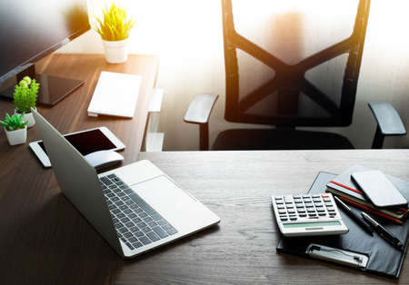 Laptop computer on office desk table with notebook, mouse computer with equipment office supplies. Workspace, project creative idea for job online network. Business and finance concept.の写真素材