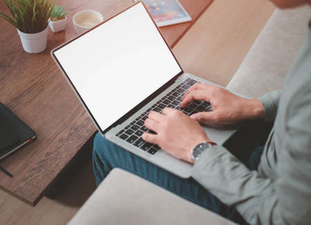 image of laptop computer notebook with blank monitor white screen display with Businessman using and...