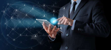 Businessman holder using tablet with touching global on social internet, digital network technology...