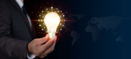 Businessman hand holding light bulb with network connection Innovative technology. Inspiration, brainstorming creative ideas for new innovations. Business technology creativity idea concept.の写真素材