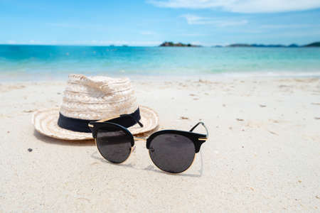 Black Sunglasses on the Sea background. beautiful sand beach as summertime, Travel and vacation concept. Holiday concept. Copy space for message.の写真素材