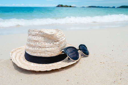Black Sunglasses on the Sea background. beautiful sand beach as summertime, Travel and vacation concept. Holiday concept. Copy space for message.の写真素材
