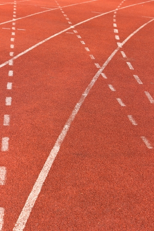 White lines on red running track の写真素材